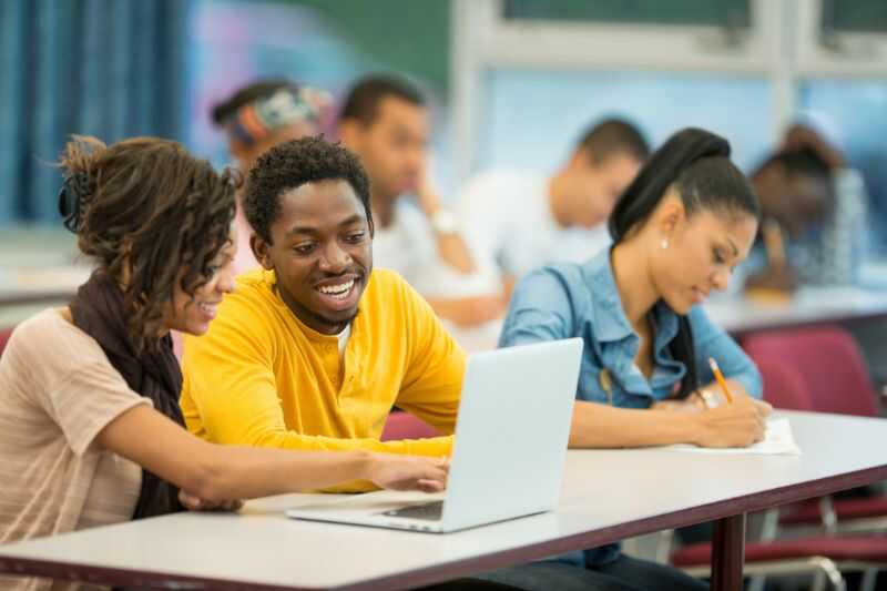 University Students Working At A Laptop