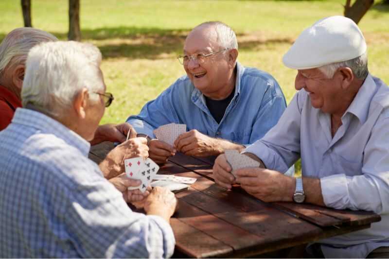 Four Elderly Men Playing Cards