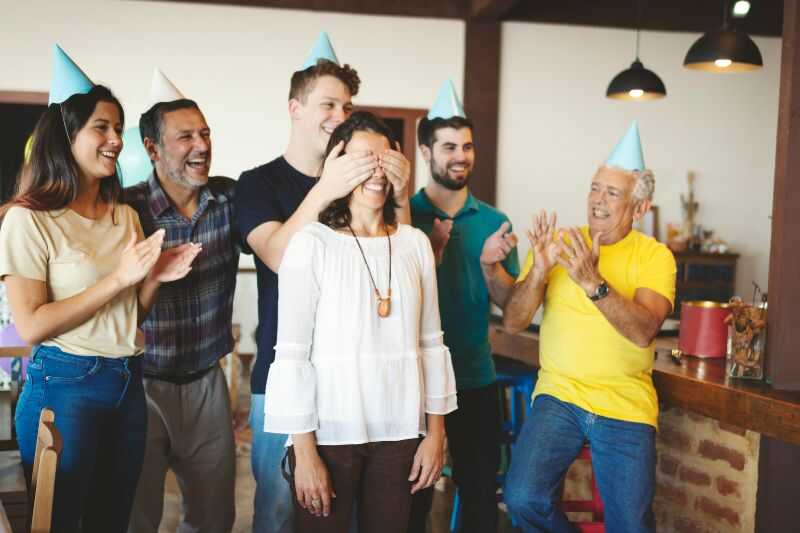 A Woman About To Be Surprised At A Surprise Party