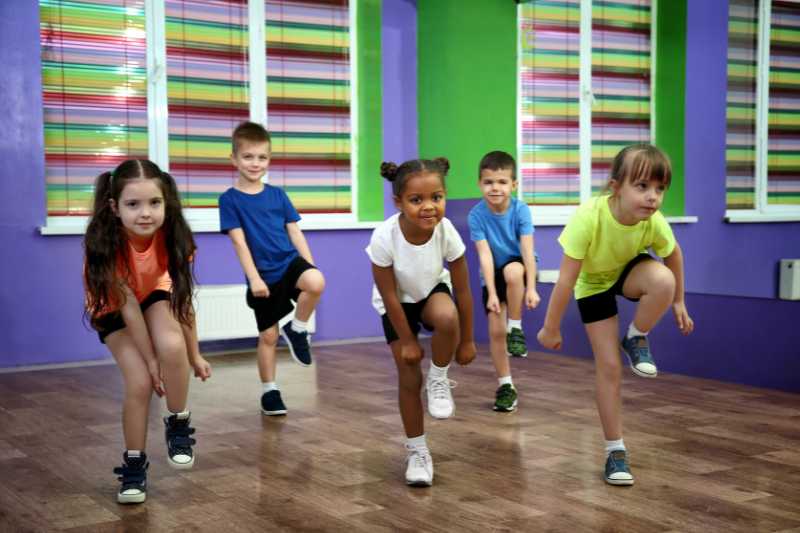 A Group Of Young Children Dancing In A Dance Studio