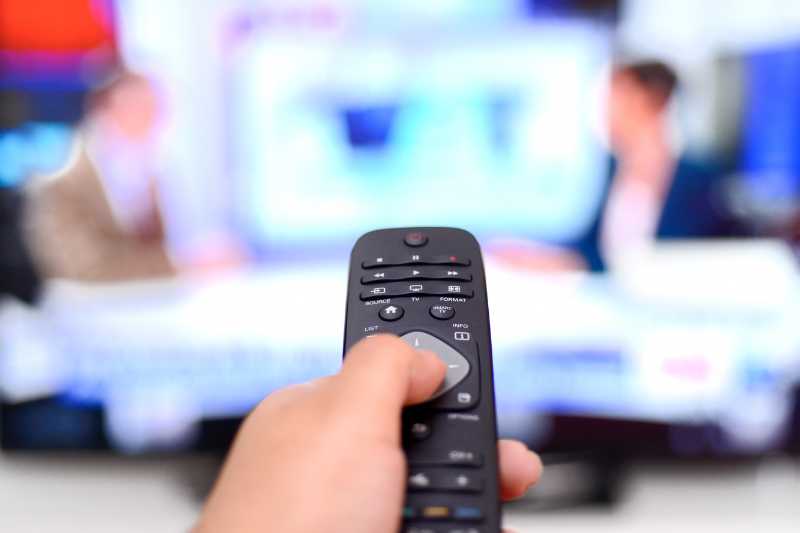 A Remote Control Pointed At A TV Screen